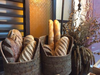 Breads loafs for sale in wicker baskets at bakery shop