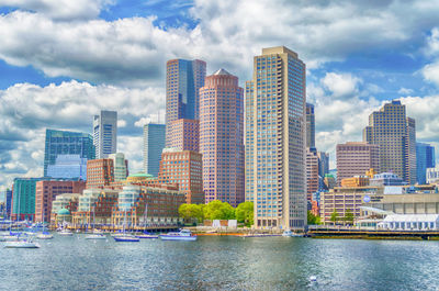 Modern buildings in city against sky