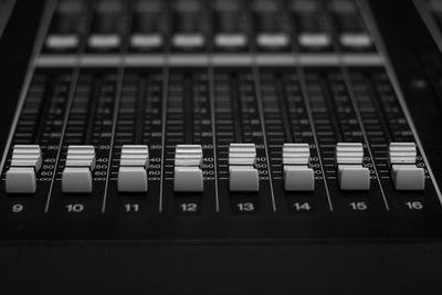 Close-up of sound mixer at studio