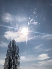 Low angle view of vapor trails in sky