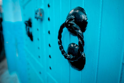 Close-up of blue door knocker