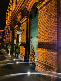 Illuminated entrance of building at night