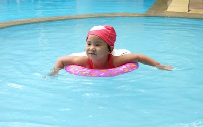 Portrait of girl swimming in pool