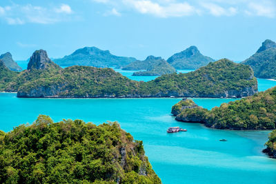 Scenic view of sea and mountains against sky