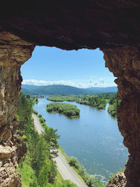 High angle view of river amidst trees against sky