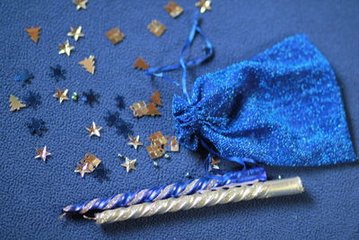 High angle view of small painting on blue background