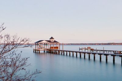 Built structure on sea against clear sky