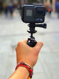 Close-up of hand holding camera