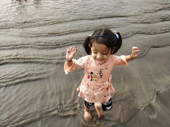 High angle view of smiling boy in water