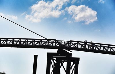 Low angle view of cables against sky