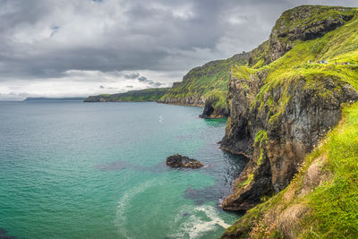 Coastline with tall limestone cliffs and turquoise atlantic ocean, near carrick a rede rope bridge