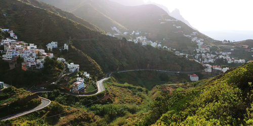 High angle view of trees and mountains against sky