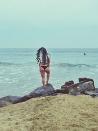 Woman standing on beach