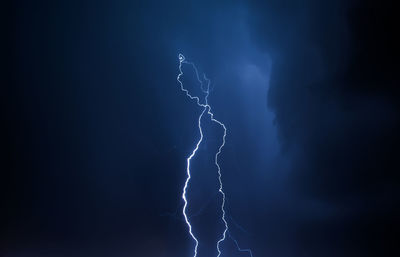 Lightning in the night sky. thunderstorm over the city. stormy dark clouds and rainy weather.