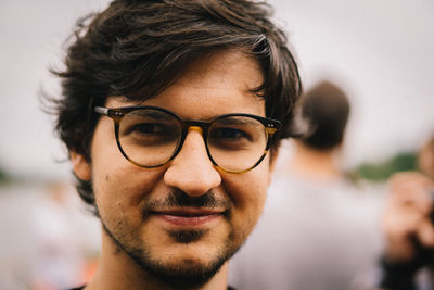 Close-up portrait of smiling young man