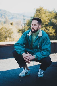 Young man sitting outdoors