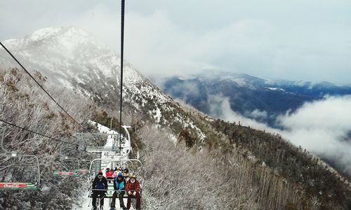 Tourist on snow covered mountain