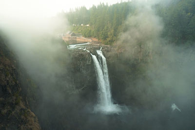 View of waterfall against sky in snoqualmie, washington state