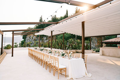 Empty chairs and tables in restaurant