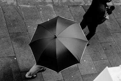 Woman standing on tiled floor