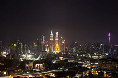 Illuminated buildings in city at night