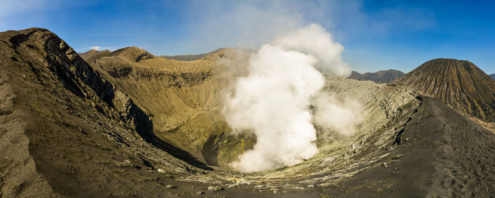 Panoramic view of volcanic landscape against sky