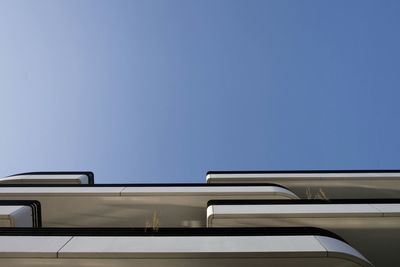 Low angle view of building against clear blue sky