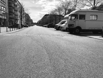 Surface level of road against sky in city