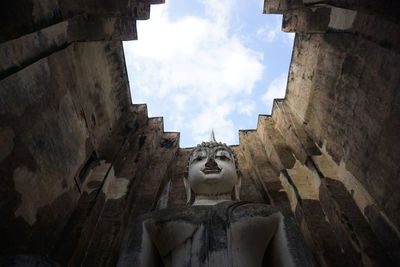 Low angle view of statue against sky