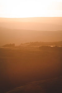 Scenic view of mountains against sky during sunset