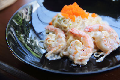 Close-up of fish served in plate on table