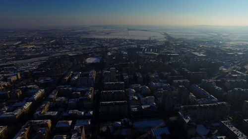 Aerial view of illuminated city against sky