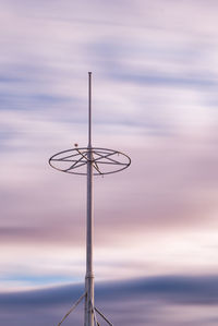 Low angle view of street light against sky during sunset