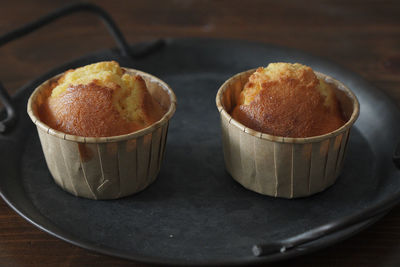 There are several delicious lemon honey cupcakes just made on the table