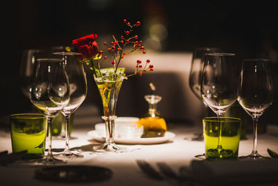 Close-up of place setting on table in darkroom