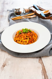 Noodles in bowl on table