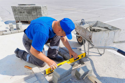 Side view of man working at construction site