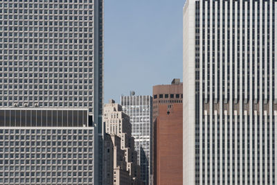 Modern buildings in city against sky