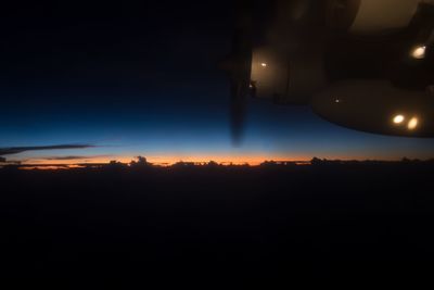 Illuminated lights against sky at night