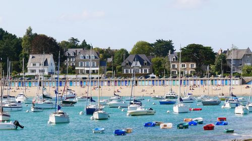 Boats moored at harbor