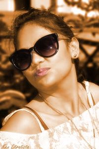 Portrait of young woman wearing sunglasses