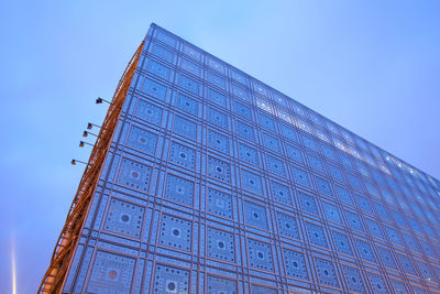 Low angle view of building against clear blue sky