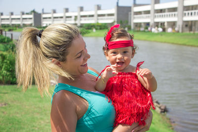 Happy girl with arms raised