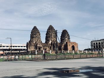 Temple against buildings in city