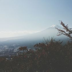 Scenic view of sea and mountains against sky