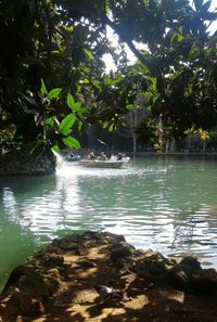 Scenic view of water flowing through rocks in forest