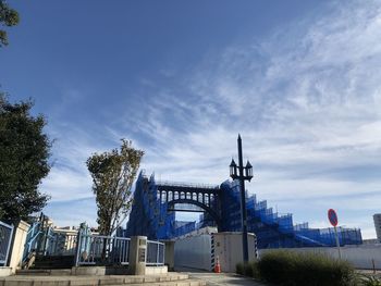 View of bridge against cloudy sky