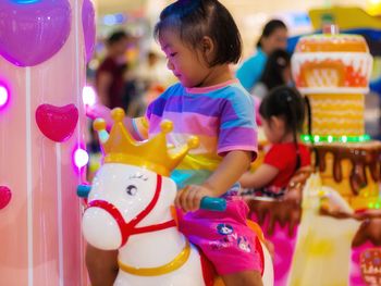 Rear view of girl in amusement park