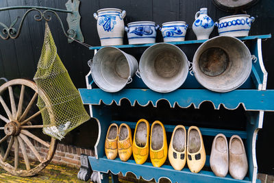 View of pottery and shoes for sale at market