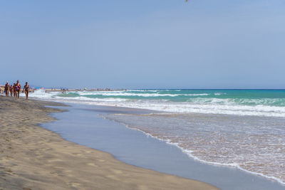 Scenic view of beach against clear sky